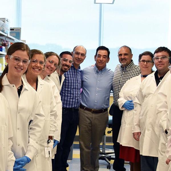 a group of people in lab coats